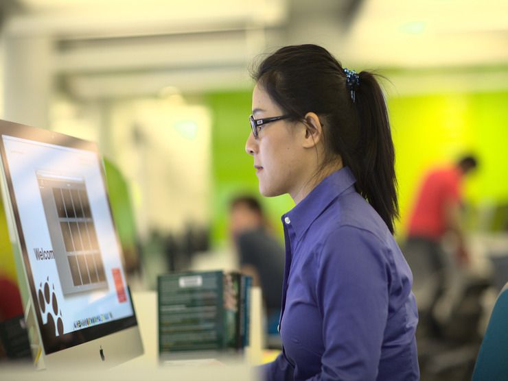 employee sitting at computer