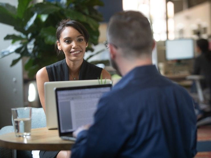 co-workers sitting at table 