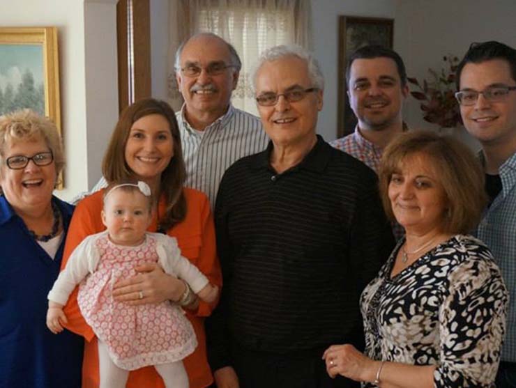 family photo with baby and grandparents