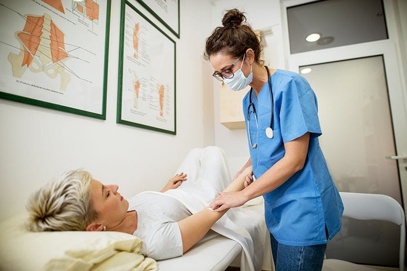 Frontline healthcare worker caring for patient