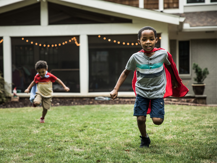 Two children playing in the backyard