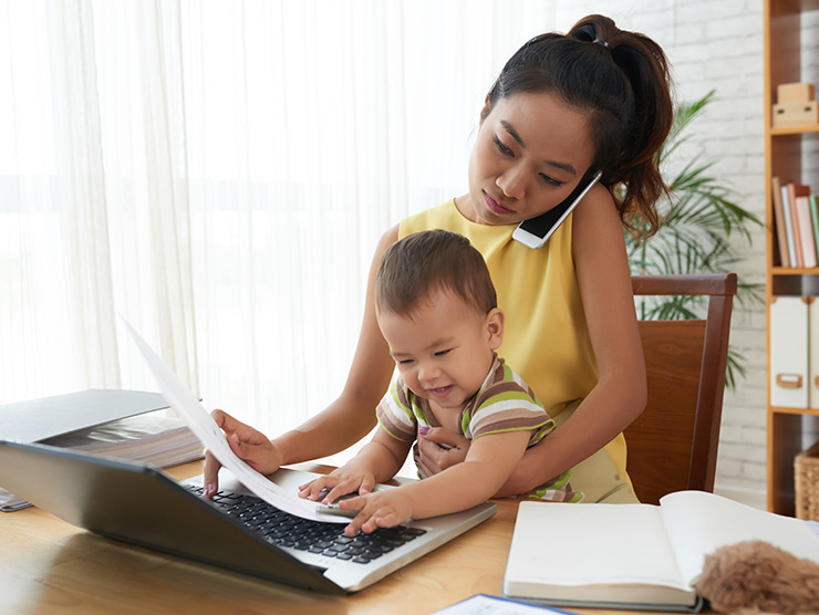 Working mom holding baby