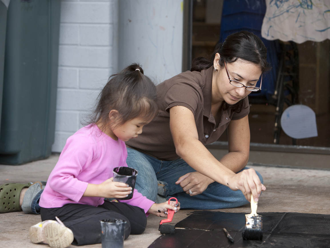 Parent and child practicing process art together