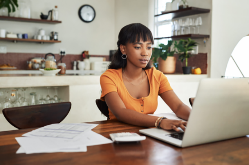 Woman of color using her education assistance benefit after work