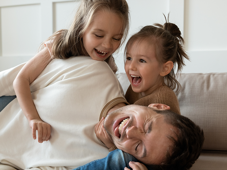 A father with his two daughters