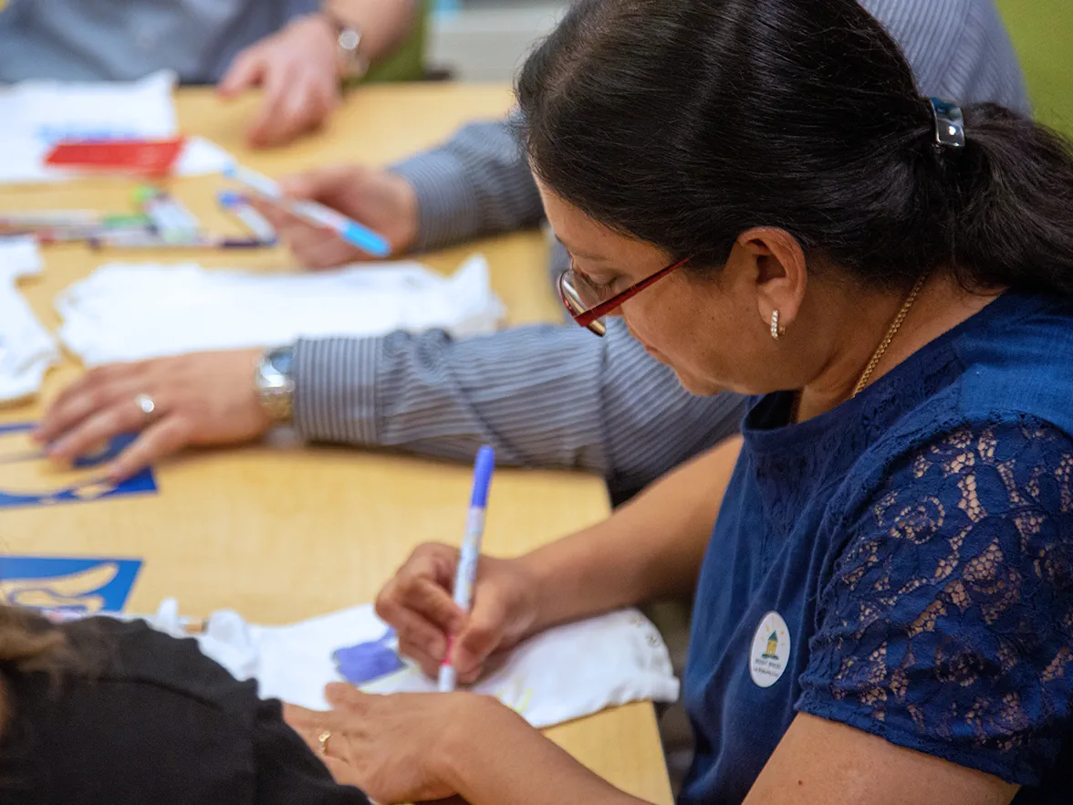 Community Bright Horizons women writing notes